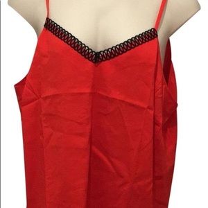 Beautiful vibrant red camisole with black front trim. Can be dressed up or down.